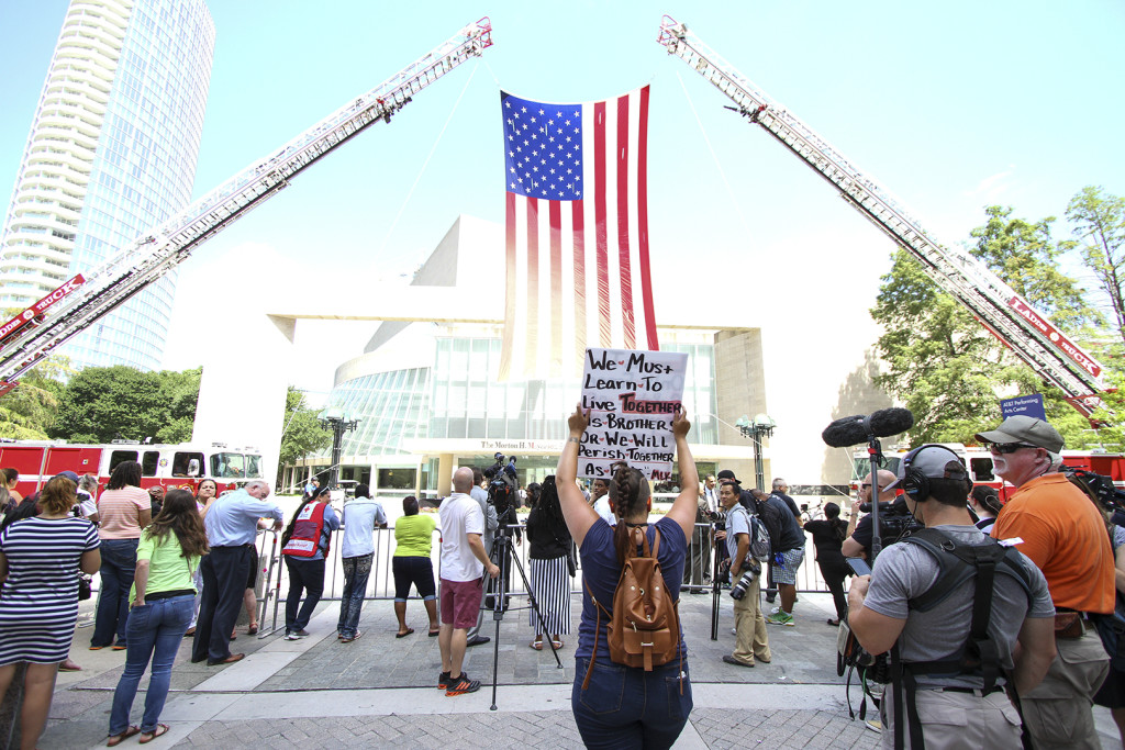 People begin to gather at the Morton H. Meyerson Symphony Center for the interfaith memorial service that honored the five officers who lost their lives in last week's shooting in downtown Dallas.
