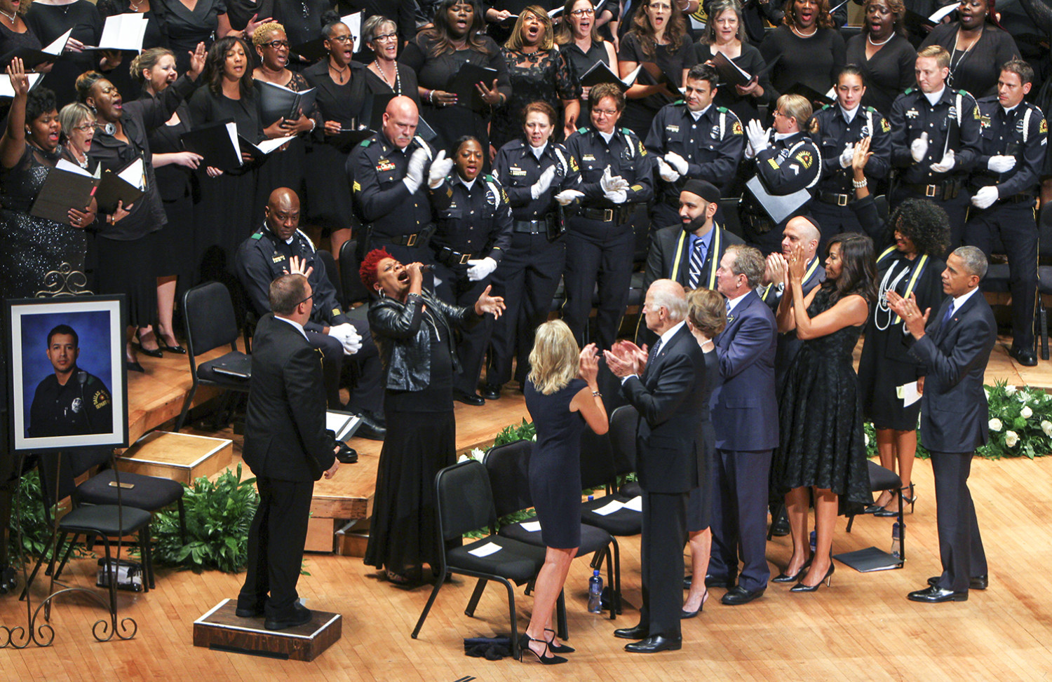 Current and former leaders of the United States stand as the choir commemorates the fallen officers and those impacted by the shooting in downtown Dallas.