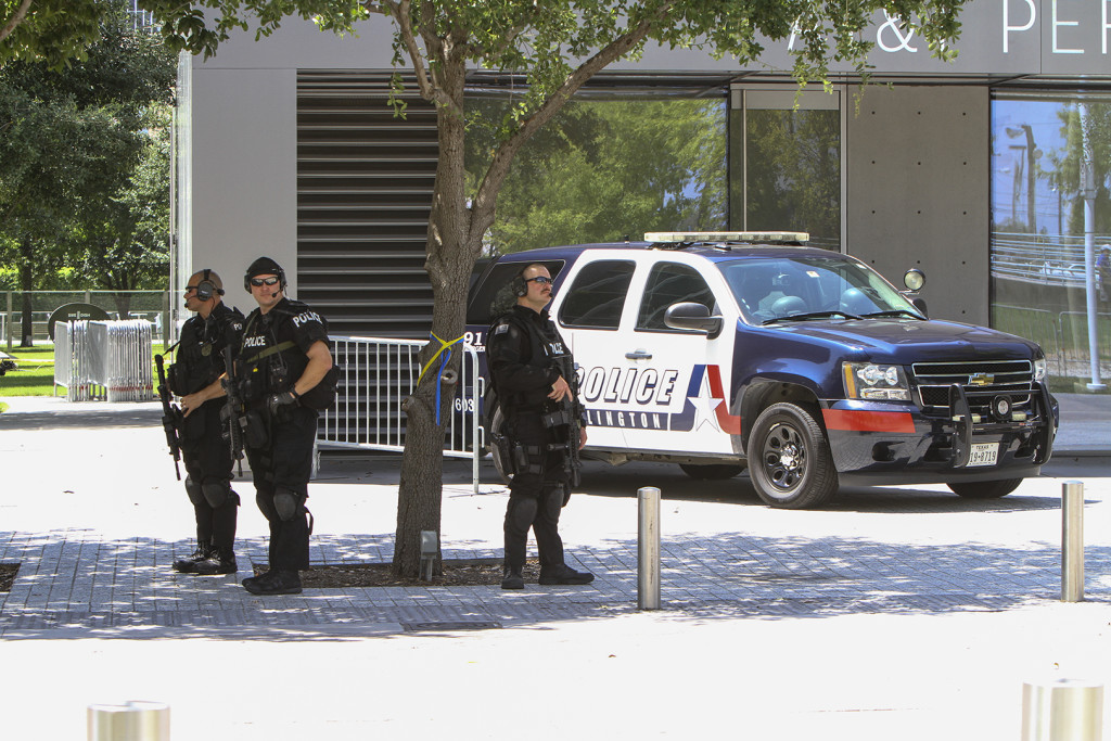 Arlington Police monitor the perimeter of the venue on July 12 where an interfaith tribute was held for the five officers who died in the line of duty last Thursday. 