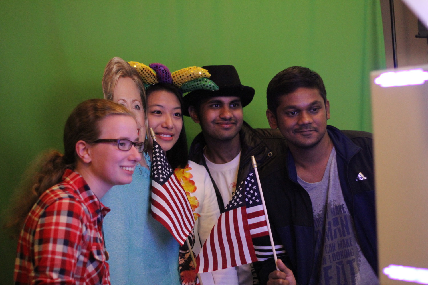 Political science sophomore Madeleine Keith (left), marketing graduate student Haiyun Chen, business analytics graduate student Ganesh Kumar and management science graduate student Naman Bader pose with a Hillary Clinton cutout at the election watch party. 
