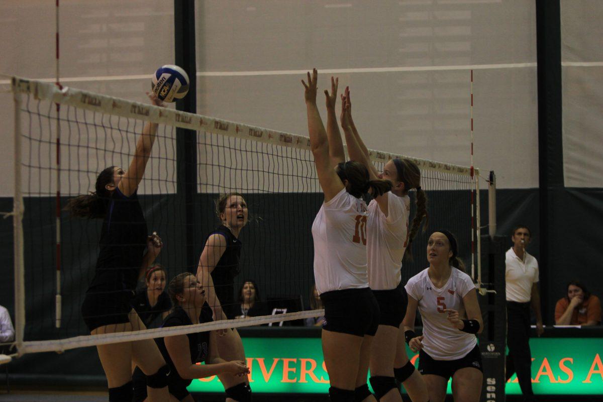 Arun Prasath|Staff Photographer
Two Comets jump up to defend a lobby from LeTourneau while senior middle blocker Taylor Toso looks on. The team went 25-15, 25-9, 23-25 and 25-13 against the YellowJackets on Sep.30.