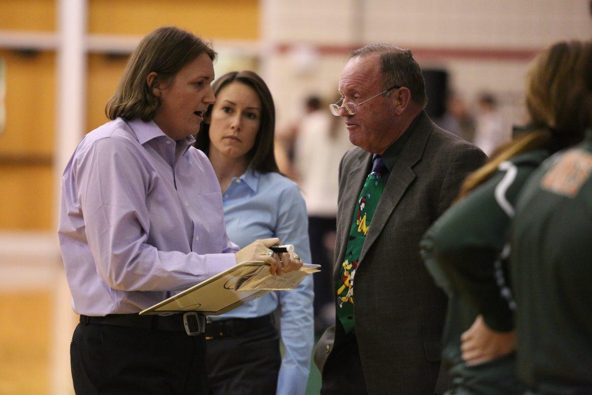 Yang Xi| Staff
Head women’s basketball coach Polly Thomason (left) consults with her assistant coaches Mallory McAdams (center) and James Thomason  during a timeout. James, who is Thomason’s father, coached for 15 years at the middle school and high school levels.