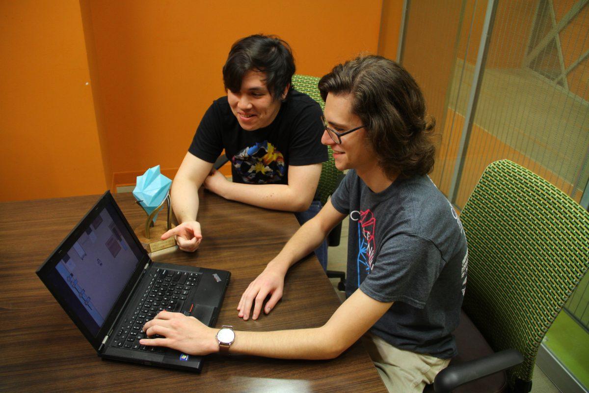ATEC juniors David McCullough (right) and Brandon Blakemore bounced between a few ideas before settling on “Don’t Rock the Boat,” a game centered around a waiter who tries to serve customers while on a ship rocking back and forth. Photo by Esteban Bustillos | Mercury Staff.