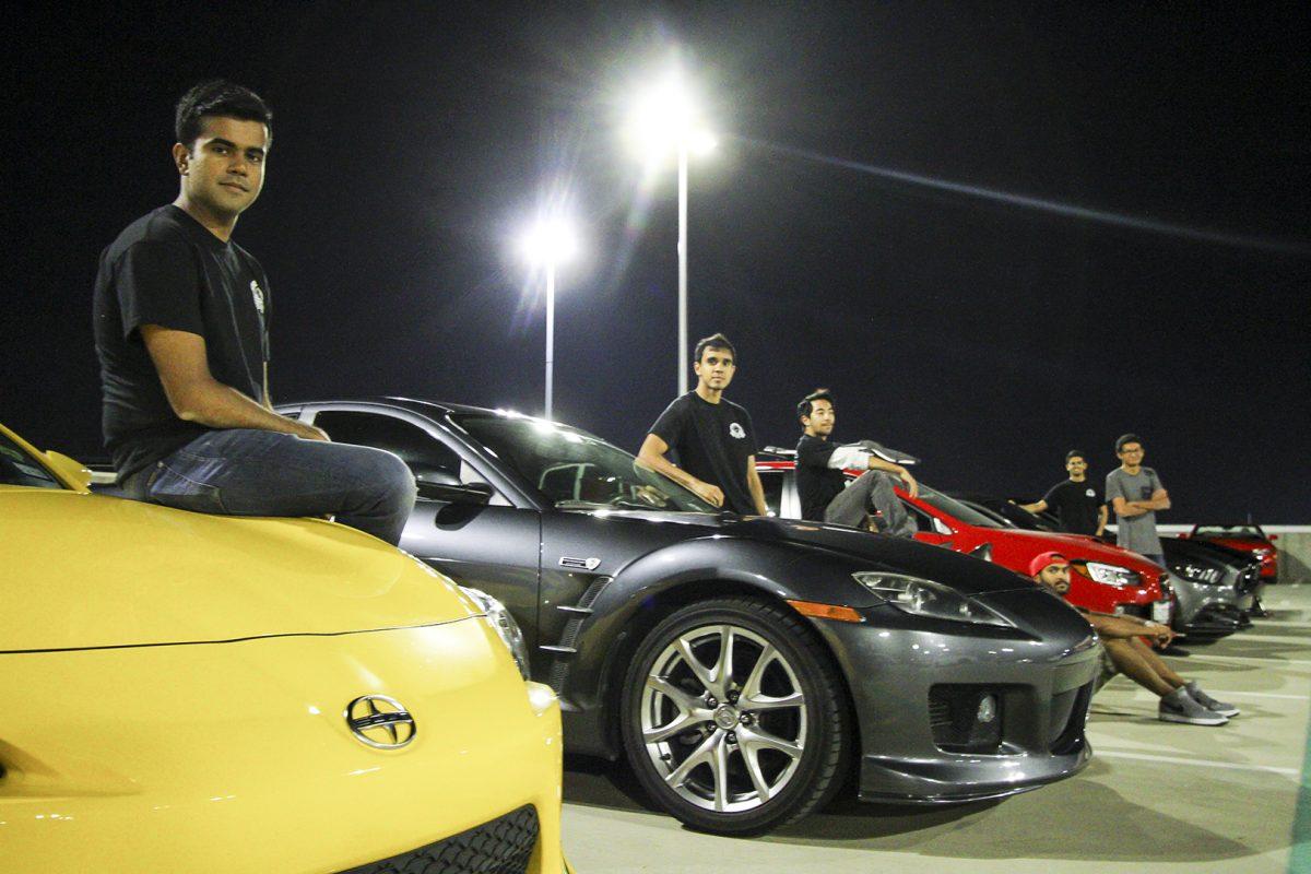 The Driver’s Club at UTD met on Oct. 1 on the roof of Parking Structure 3 to host their monthly Cars and Comets meet-up. Muhammad “Fez” Babar (front) is the president of the club and helps organize the event. Photo by Saher Aqeel | Assistant Photo Editor.