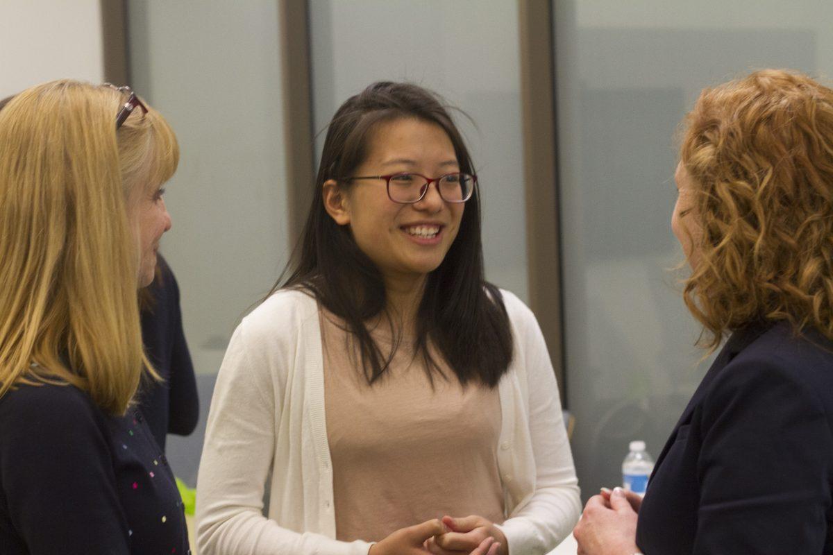 Students network during the Women in Technology International event in the undergraduate lobby in JSOM. As part of the event, speakers gave attendees tips on getting ahead as a woman in STEM. Photo by Noah Whitehead | Mercury Staff.