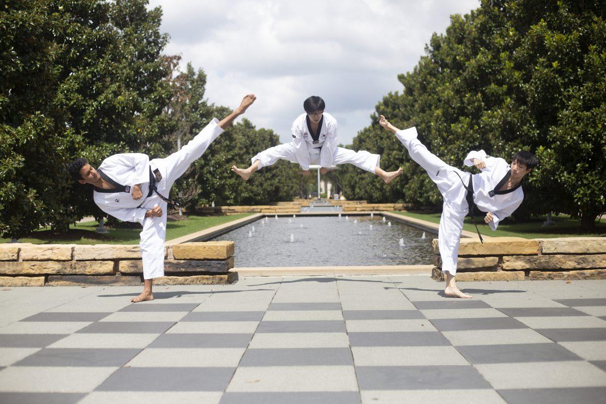 Biology junior Nishant Tyagi (left), mechanical engineering junior Yoojun Ahn (middle) and biomechanical engineering junior Wooyoung Choi are members of the Taekwondo club, which started this semester. Photo by Noah Whitehead | Photo Editor.