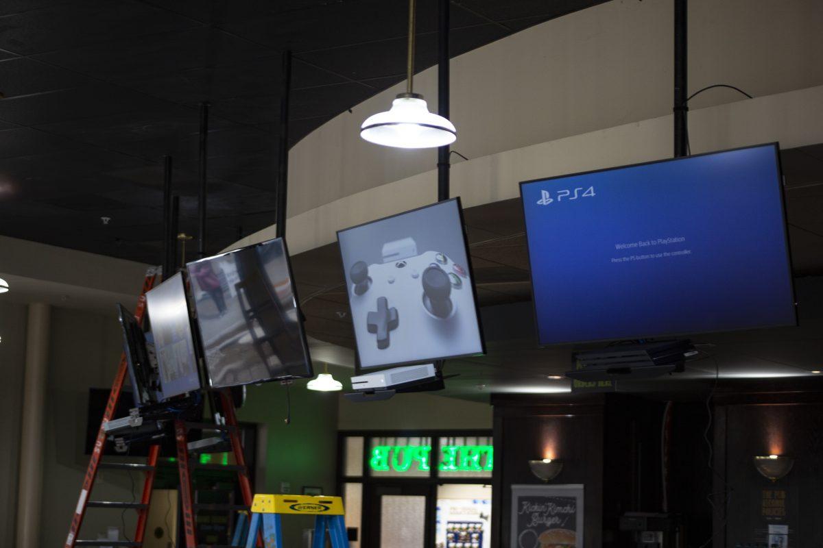 The new gaming cafe in The Pub features access to Xbox One and Playstation 4 consoles for students to play free of charge. Photo by Noah Whitehead | Photo Editor.
