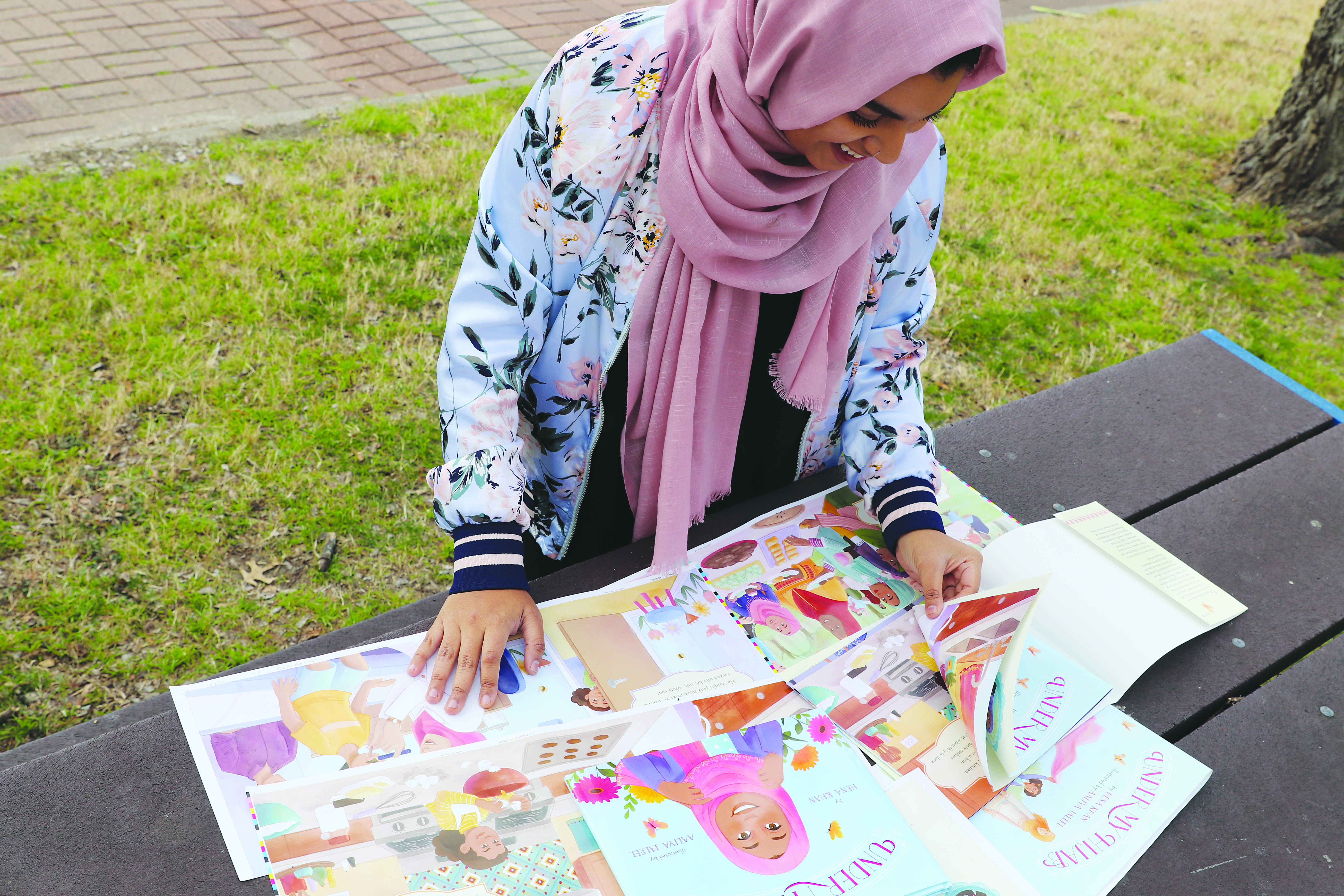 Hijabi student illustrates to inspire