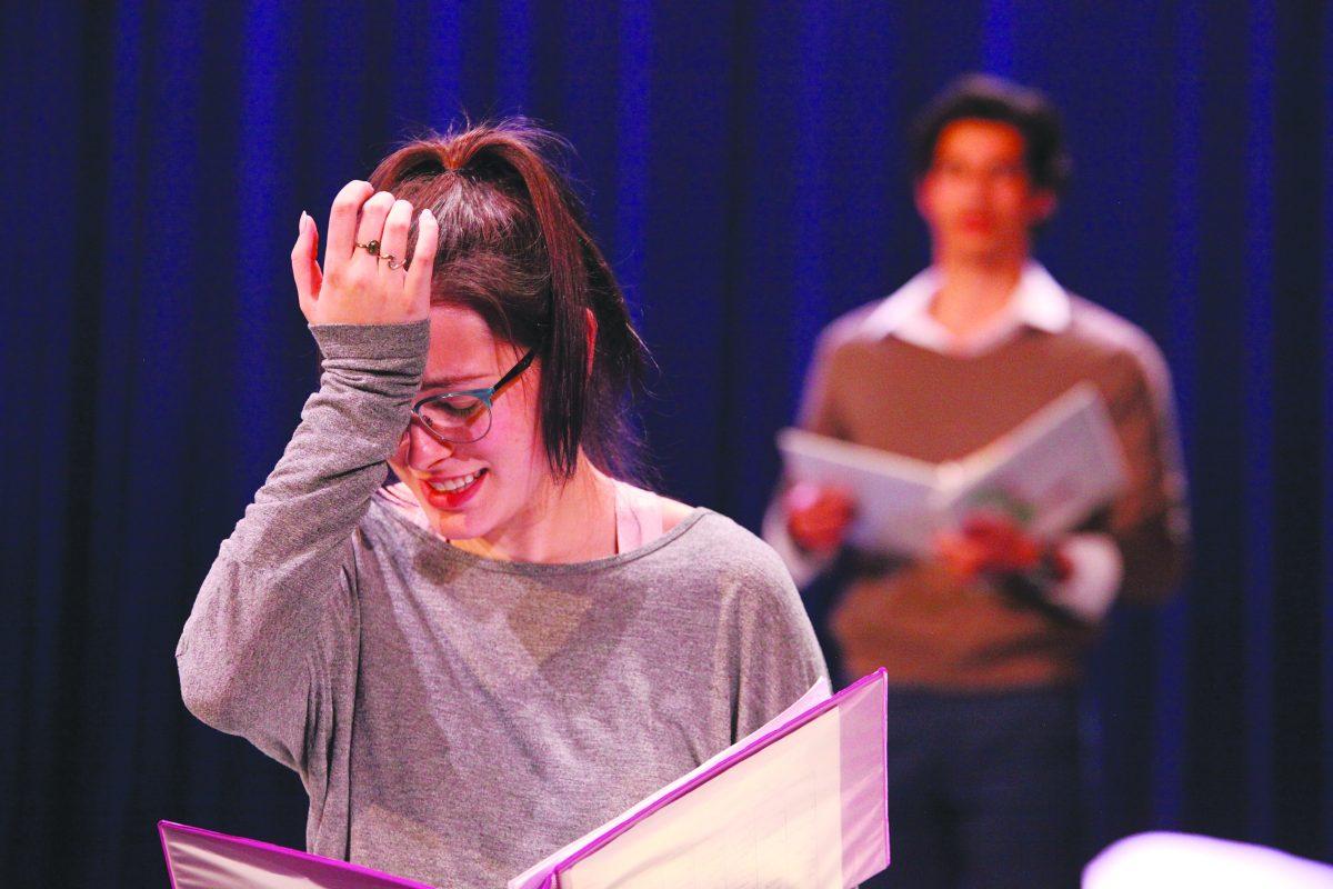 Visual and performing arts junior Alexandra Schmid and marketing junior Carlos Manuel practice a scene in the upcoming play “The Flu Season.” Photo by Pavan Tauh | Mercury Staff.
