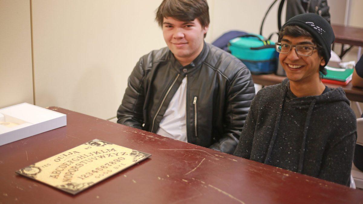 Computer science freshman Jarod Shelton (left) and sophomore Rishi Chandna (right) began using the Ouija board out of curiosity before getting other students involved. Photo by Bhavan Mehta | Mercury Staff