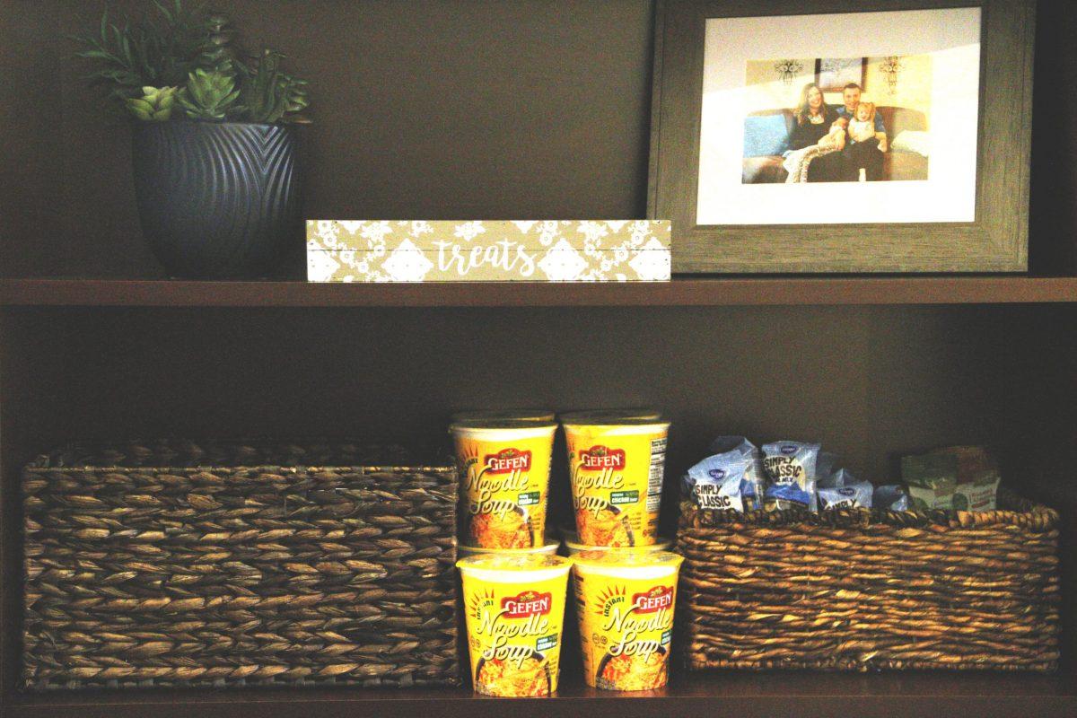 Schwark was rearranging her office last semester when she decided to use her bookshelf space as a makeshift pantry. Photo by Roshan Khichi | Mercury Staff