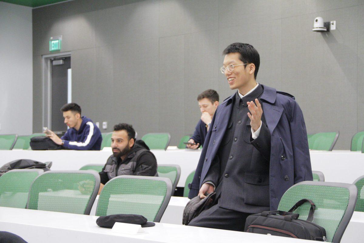Internatioal political economy senior Ronald Chan dons a Chinese Zhongshan daily. Photo by Roshan Khichi | Mercury Staff