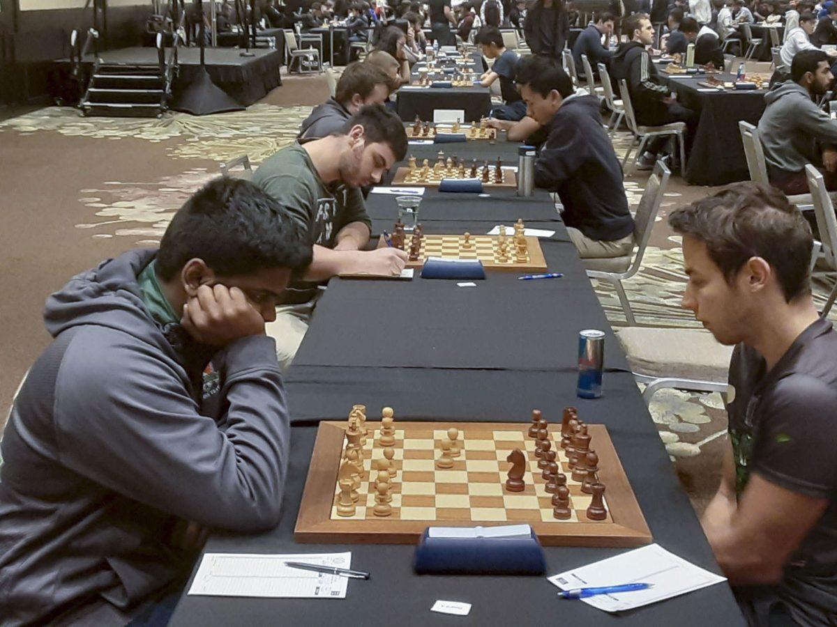 Grandmaster and UTD sophomore Rahul Peddi (left), a member of UTD Team A, won three games and drew three games. | Photo courtesy of Julio Sadorra.