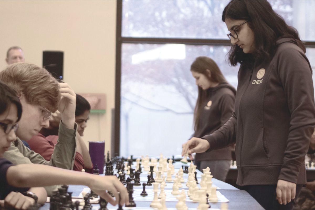 International masters Tarini Goyal (foreground) and Gergana Peycheva (background) both faced 15 students simultaneously, moving from board to board. Photo by Jack Sierputowski | Editor-In-Chief