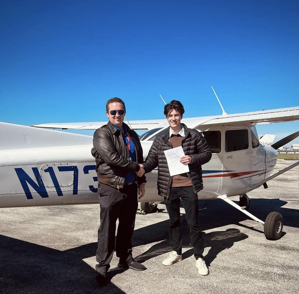 Logan James (right) with his flight instructor. Photo courtesy of Logan James' Instagram