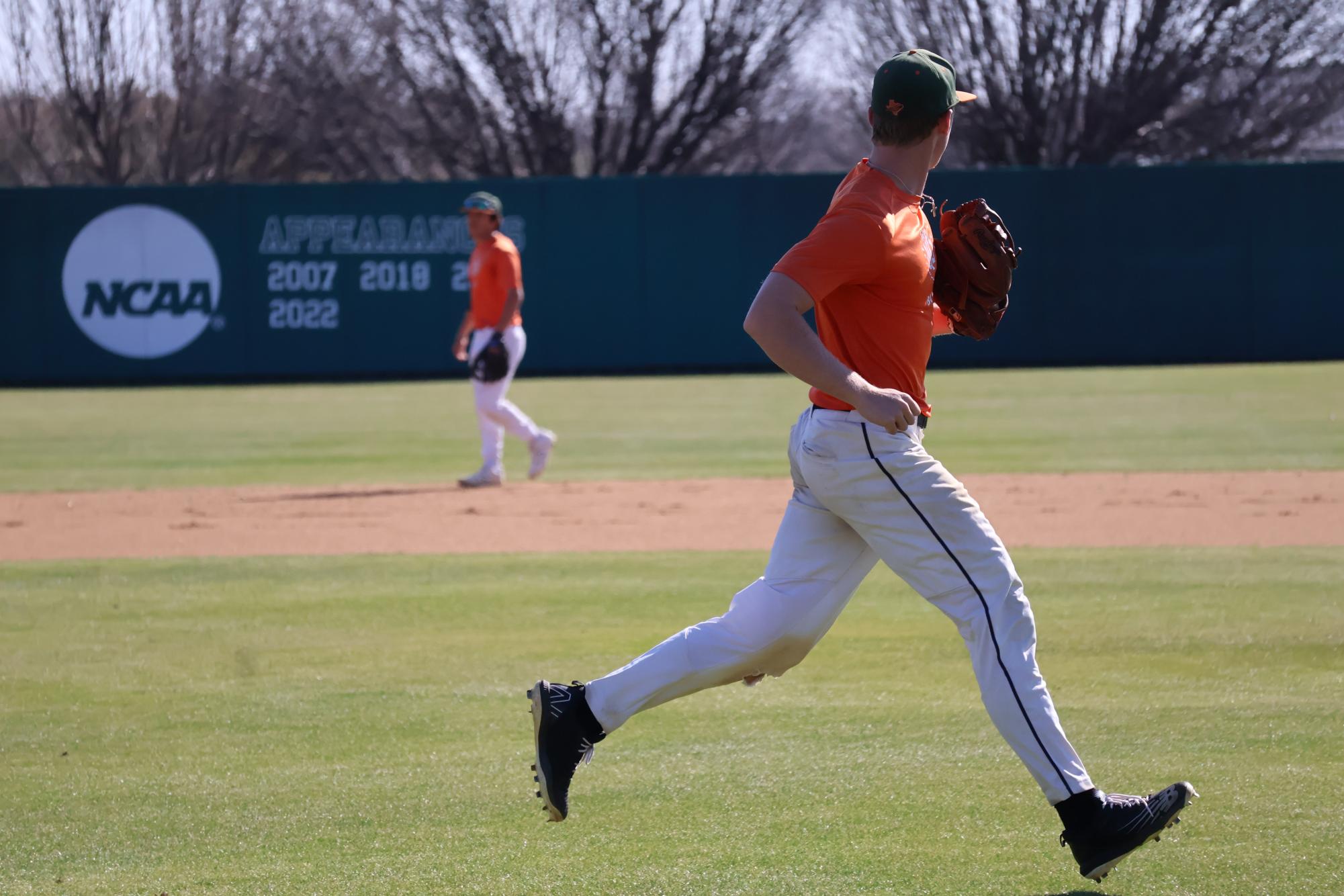 A player follows through on a throw during practice, emphasizing the team's defensive precision 