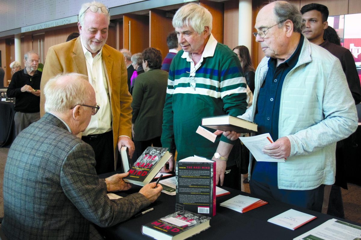 Laurence Rees signing copies of his latest book “The Nazi Mind: Twelve Warnings from History” after his lecture in the Davidson-Gundy Alumni Center on Sunday, Feb. 15.
