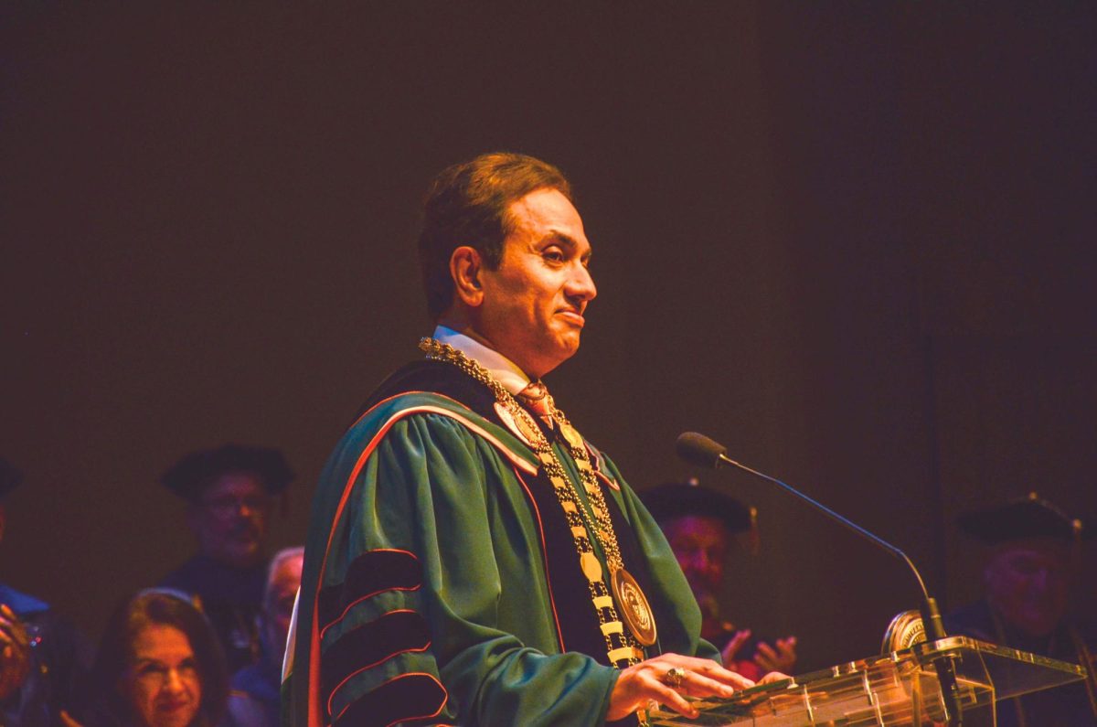 President Moghe takes the podium and receives applause. 

