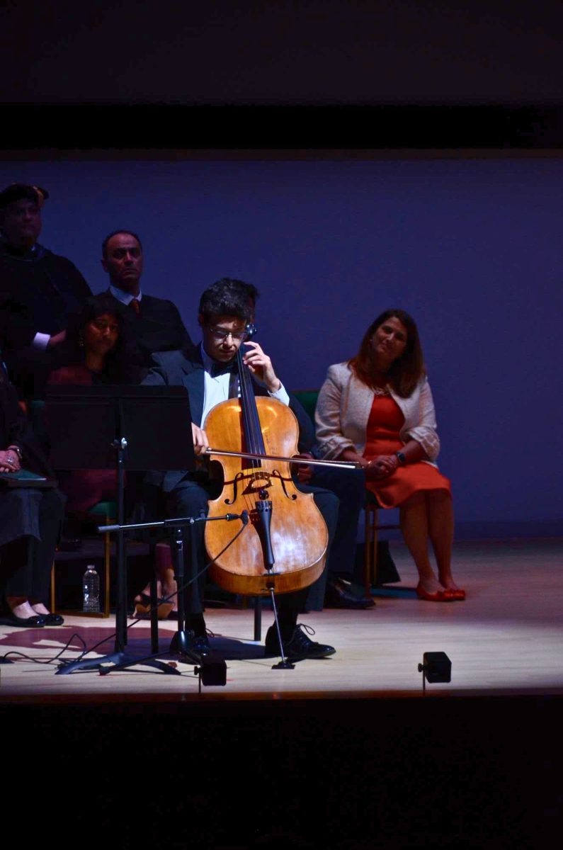 Cellist Diego Jones performs during the investiture ceremony.
