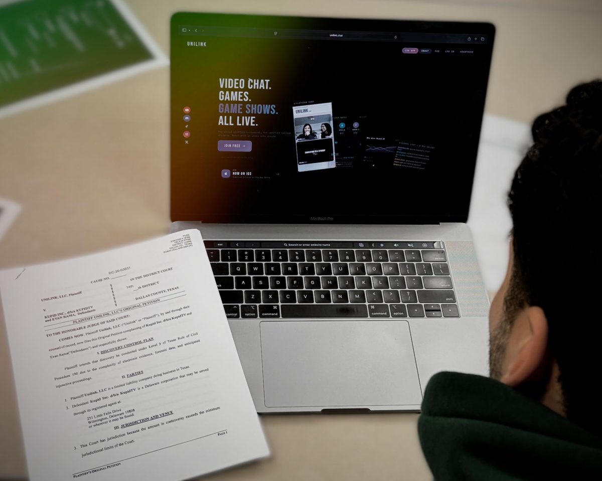 Hamza Hammad looks over the Unilink website and lawsuit documents. 