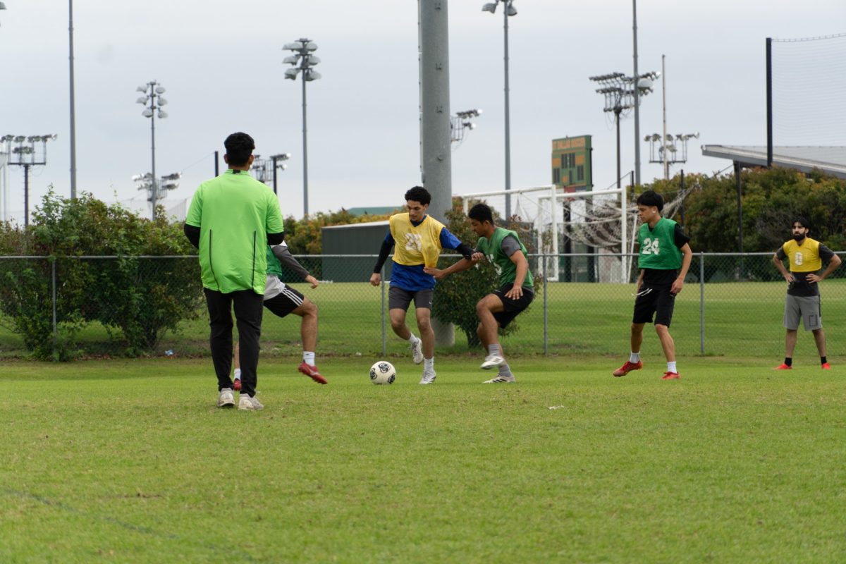 Soccer players compete during an intramural soccer match April 30.

